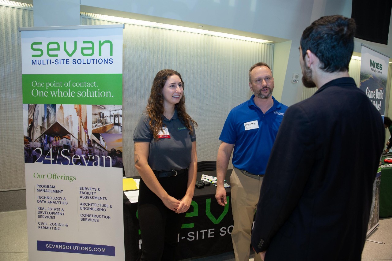 Angie Miller, UC alum who now works for Sevan (Multi-site Solutions based in Downer's Grove, IL), speaks to students at the Career Fair.