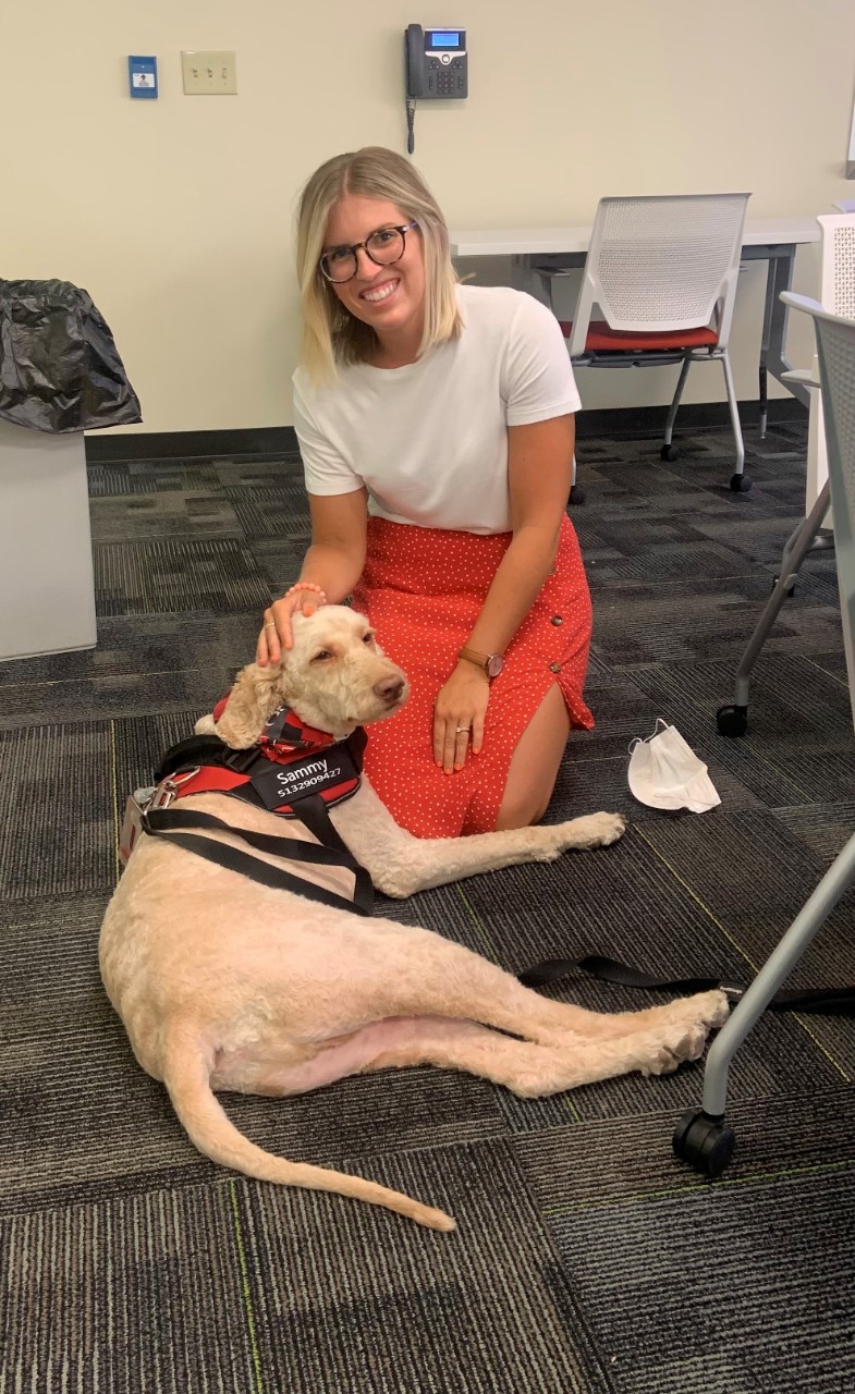 Muller petting Sammy the Service Dog. 