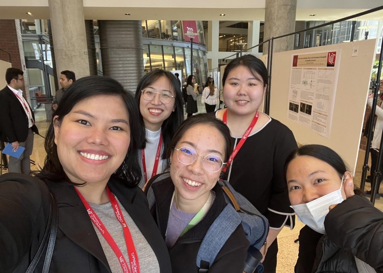 Five women stand together at a pharmacy conference.