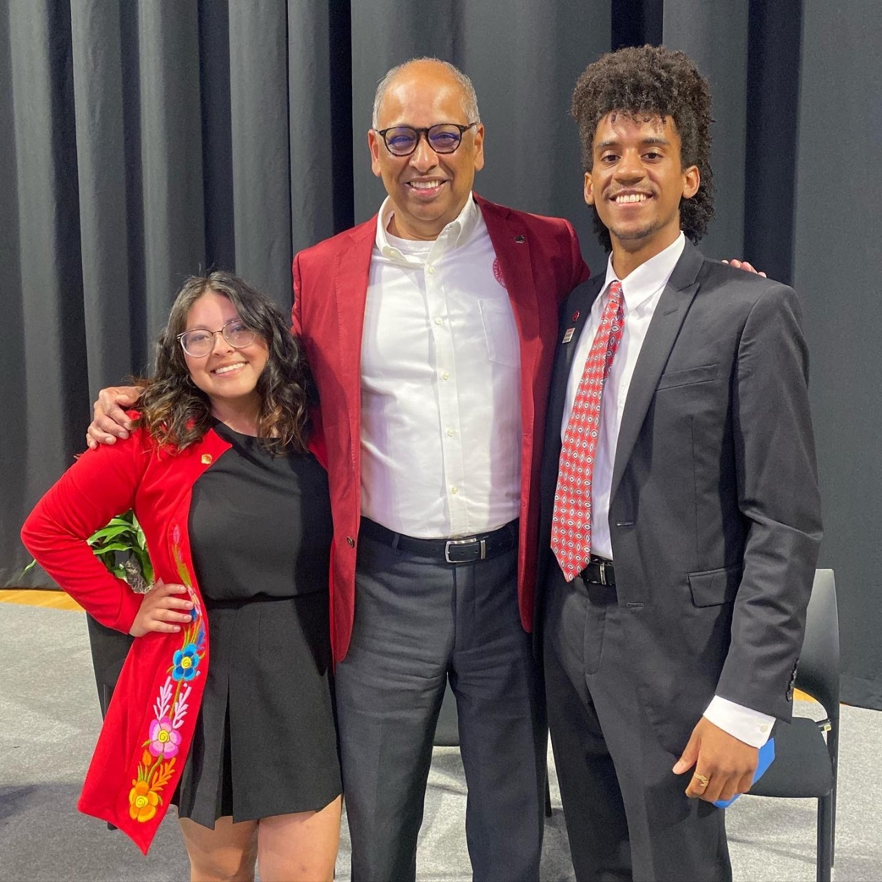 From left, Yulia Martinez, President Neville Pinto, Isaac Smitherman