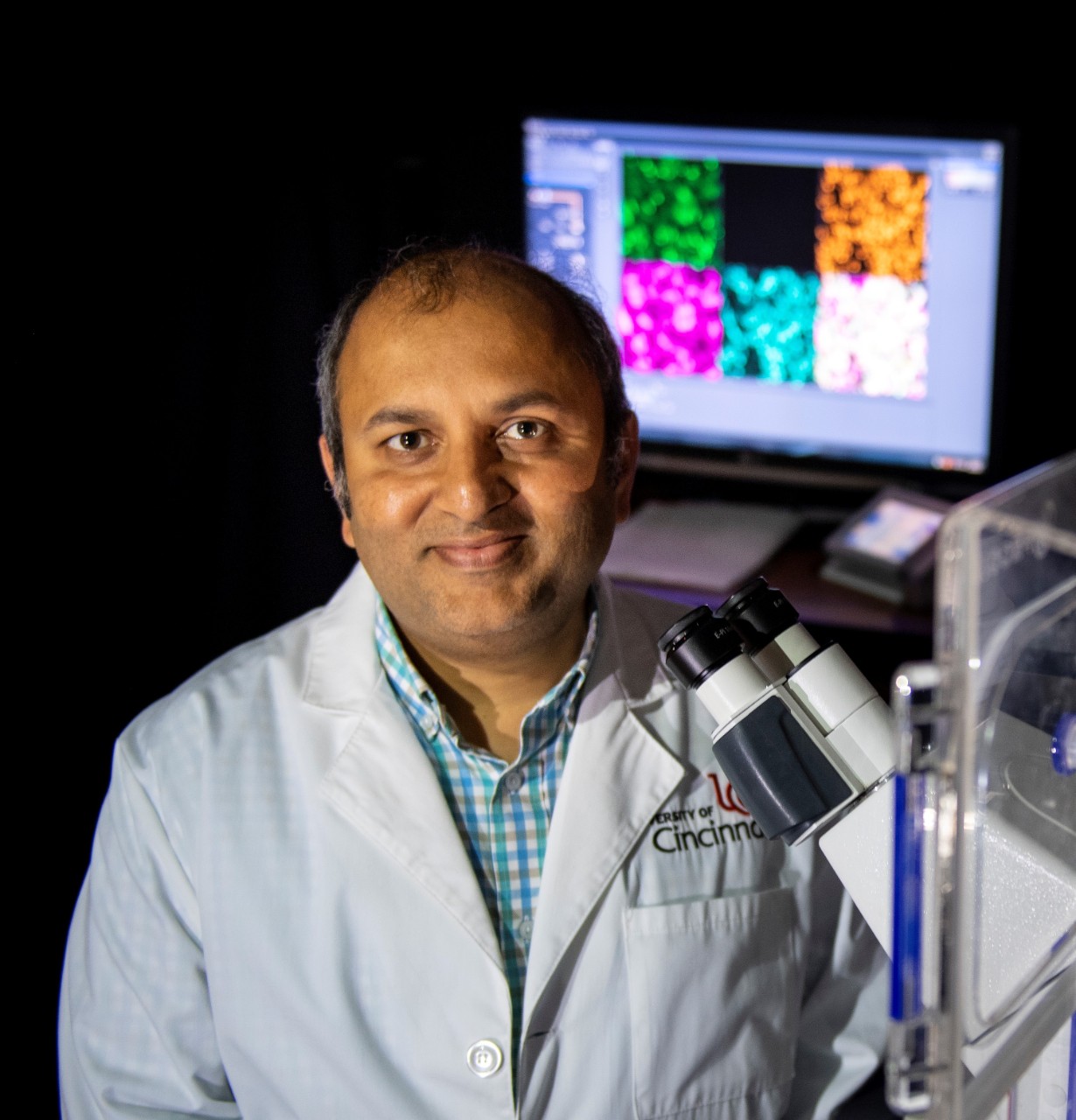 Ameet A. Chimote, PhD, in his lab and on CARE/Crawley bridge.