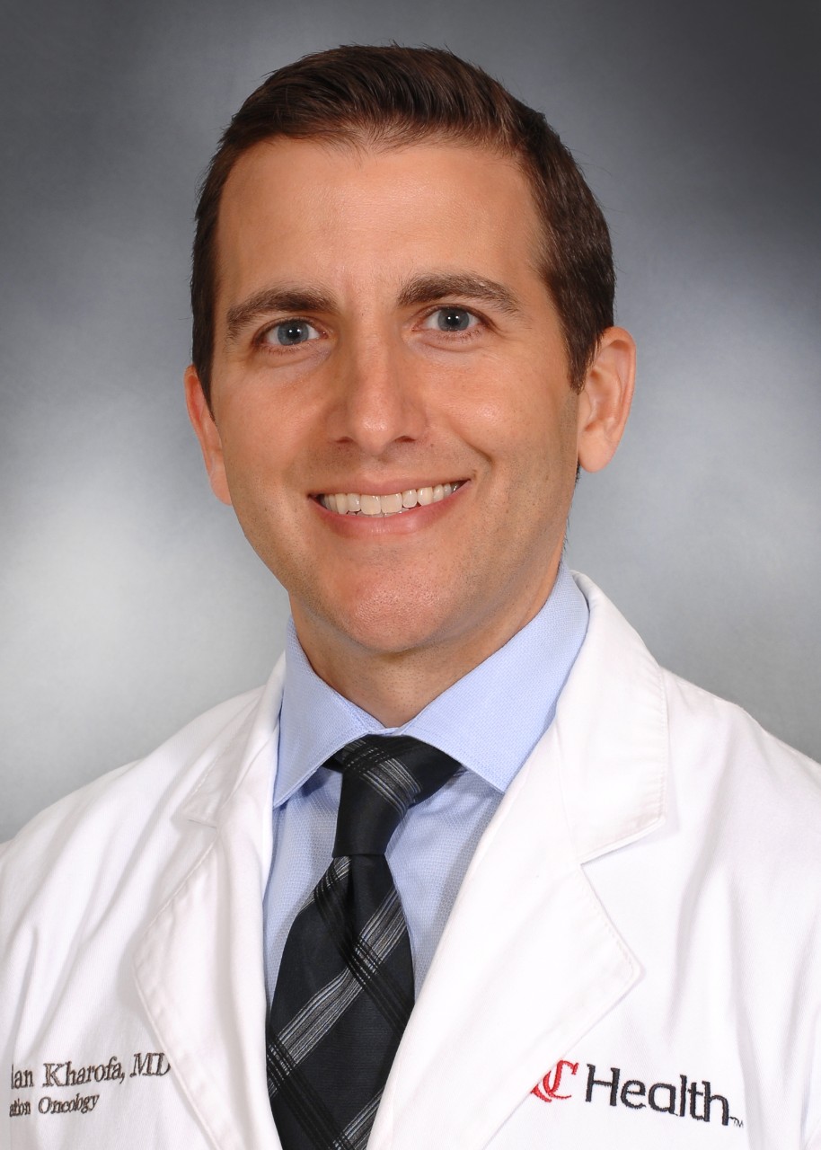 JORDAN KHAROFA WITH UCH LAB COAT  RAD/ONC