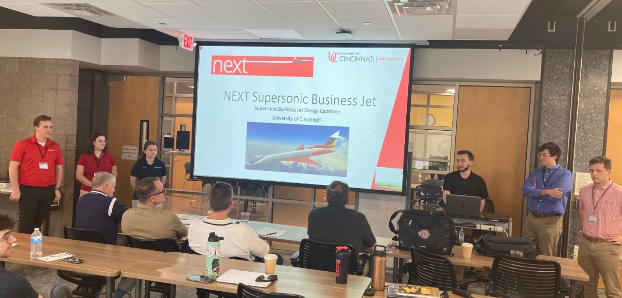 UC team members presenting aircraft design to the judges. From left to right: Jackson Dinga, Grace Fischer, Emma Ochs, Daniel Driscoll, Liam Mckenna and Will Hausfeld