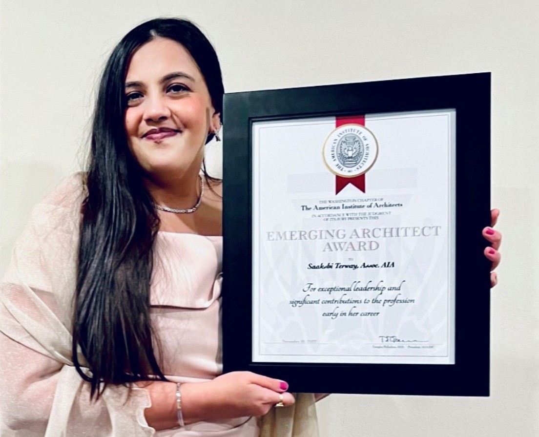 UC DAAP alum Saakshi Terway holding her framed architecture award.