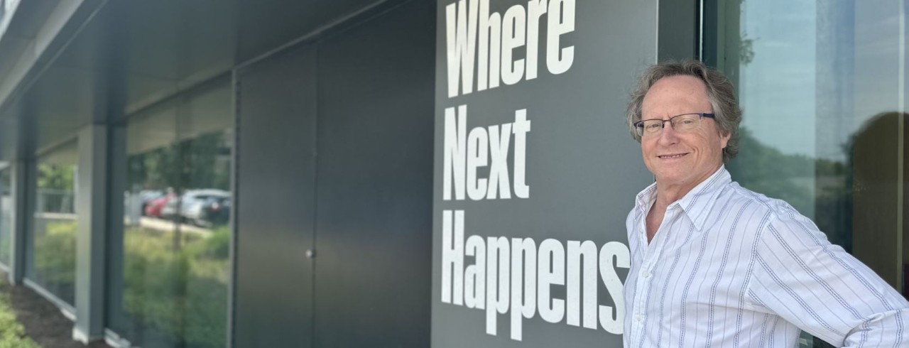 Jim Currie stands in front of the UC 1819 Innovation Hub.