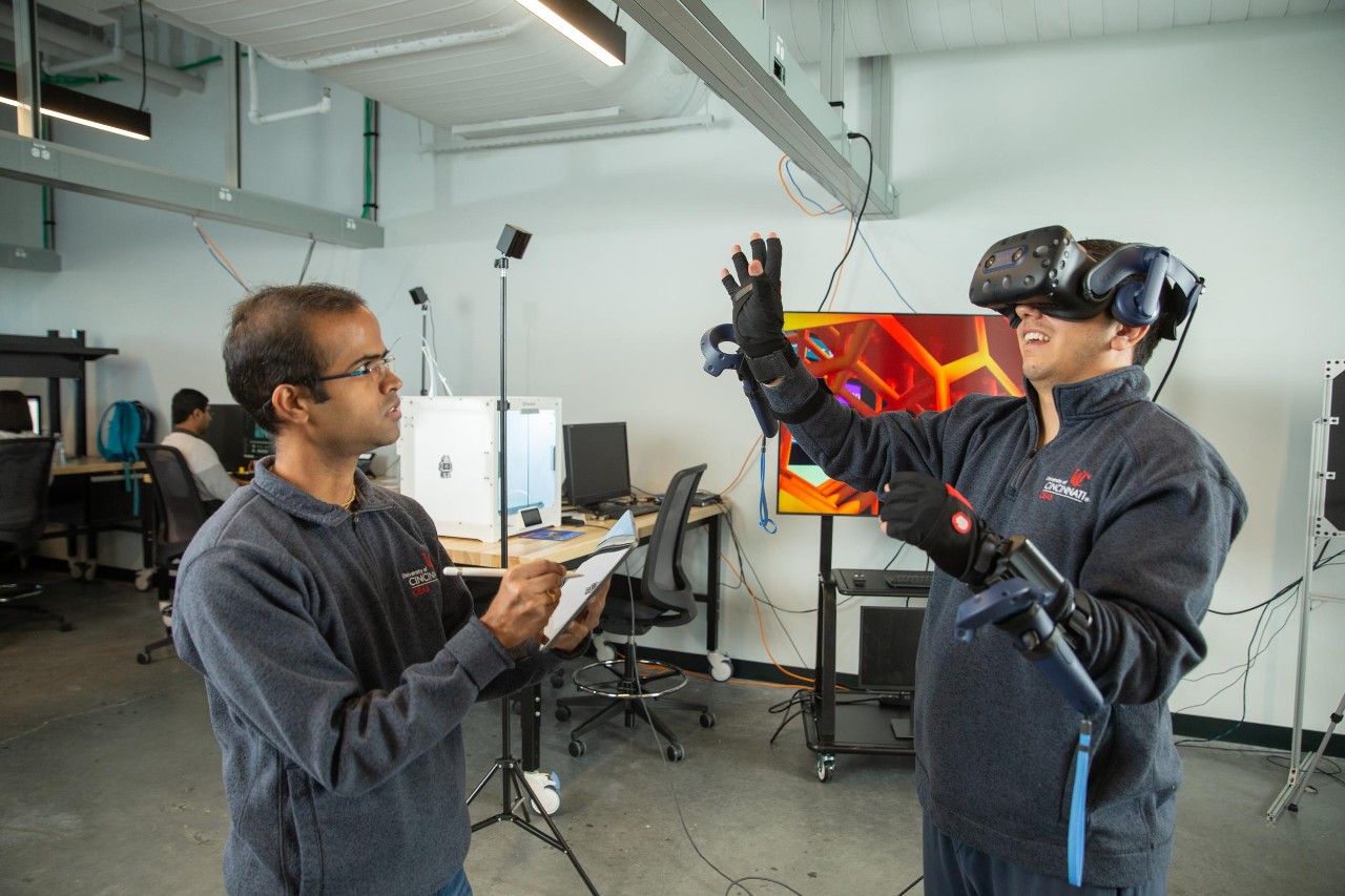 College of Engineering and Applied Science (CEAS) graduate students pose at the Digital Futures building.