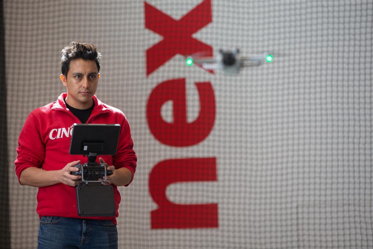 College of Engineering and Applied Science (CEAS) graduate students pose at the Digital Futures building.