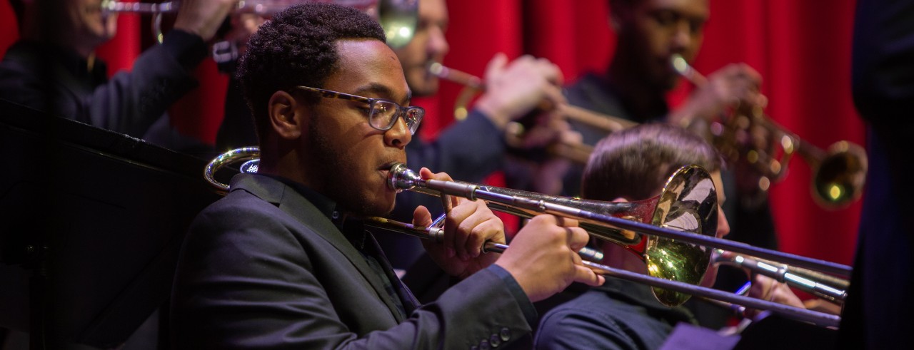 A photograph of students in the CCM Jazz Orchestra performing on the stage of Corbett Auditorium in January 2020. Photo/UC Creative + Brand