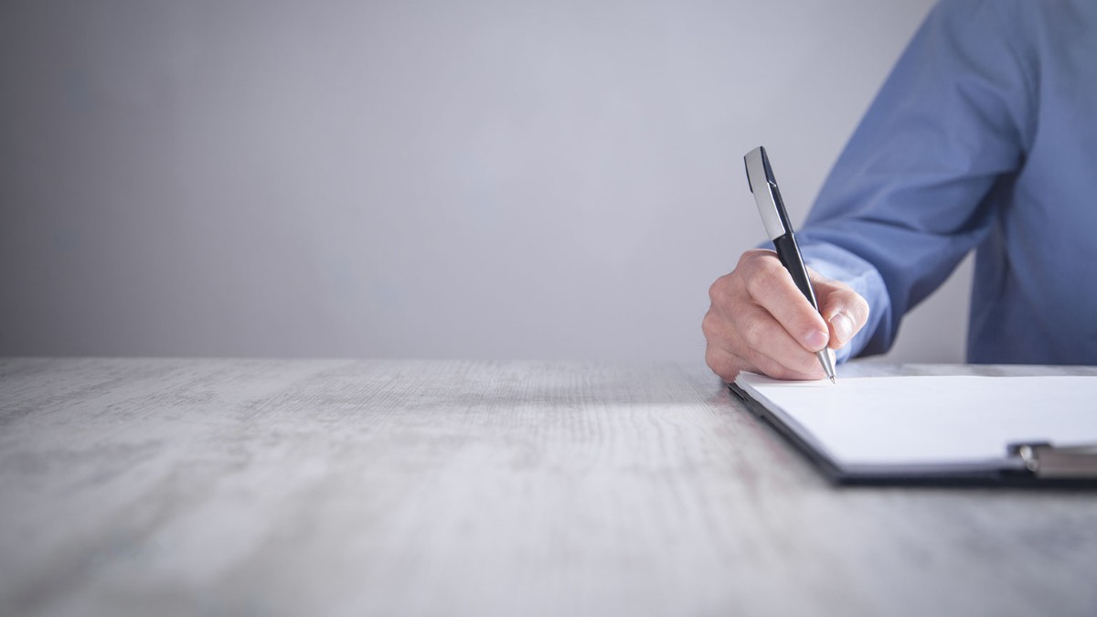 signing a paper