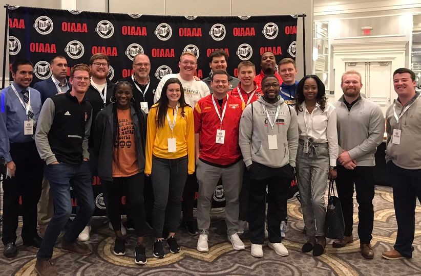 Photo of Dr. Kelley with SPAD graduates at the OIAAA conference.