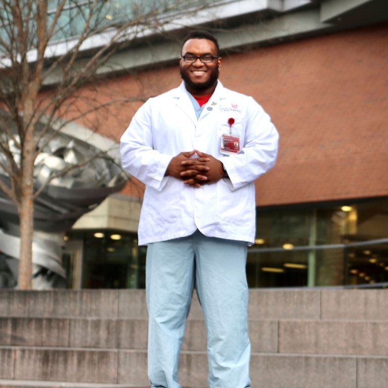 Will Smith, MD '24 standing in front of the CARE/Crawley Building