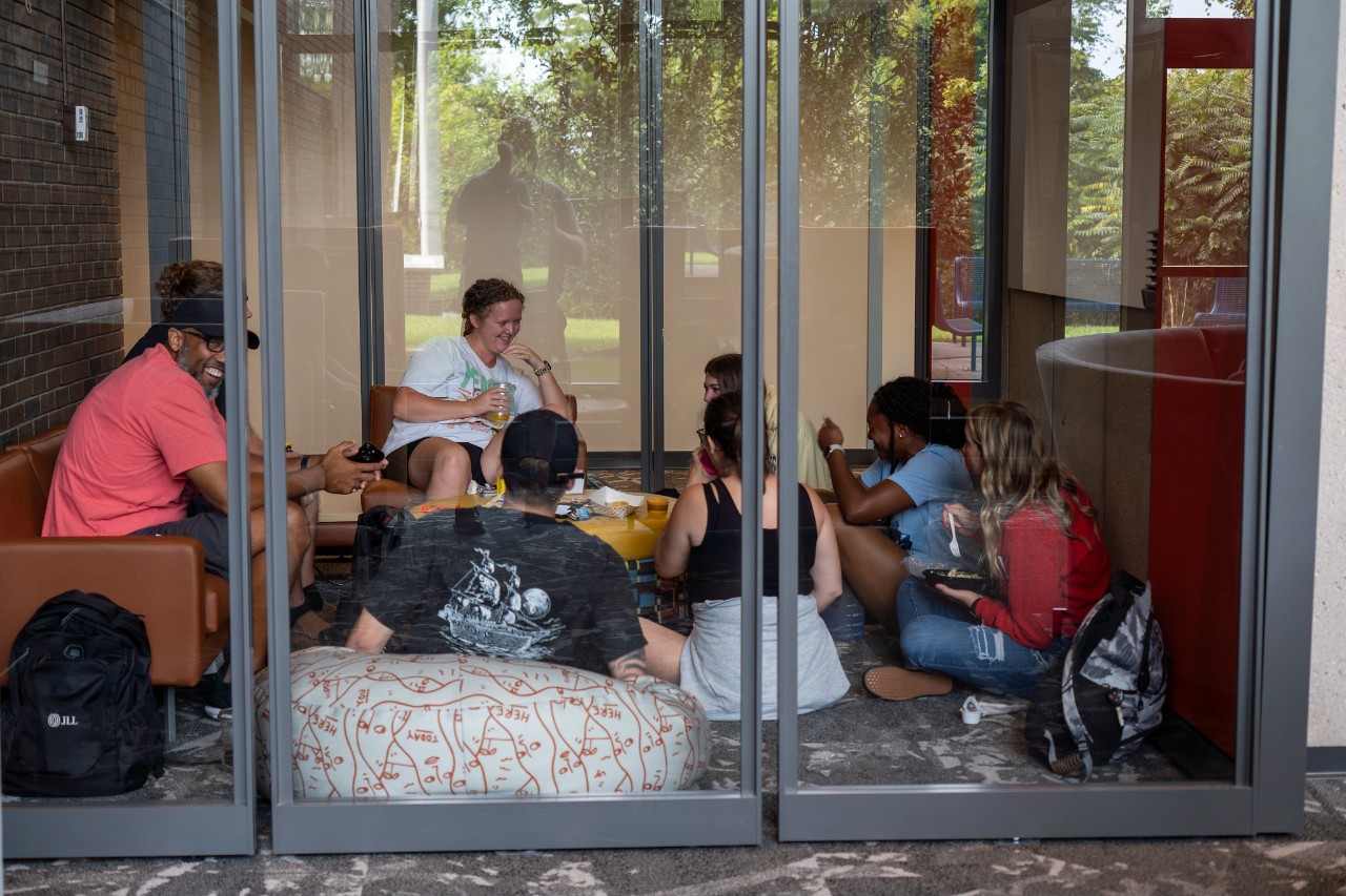 students talk and laugh in UC Clermont's student lounge