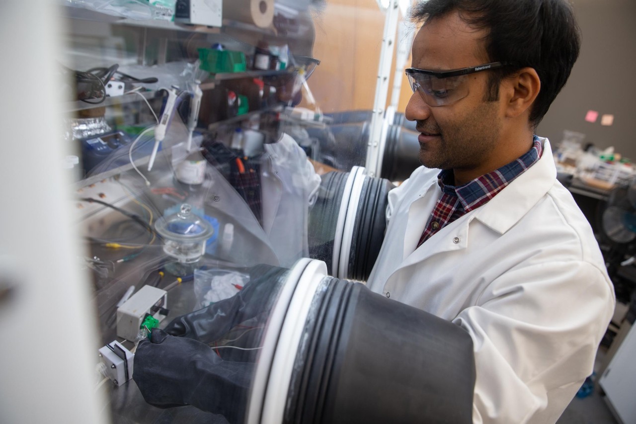 Jianbing "Jimmy" Jiang and his students working in his lab, where they have created a new battery with widespread applications for renewable energy.