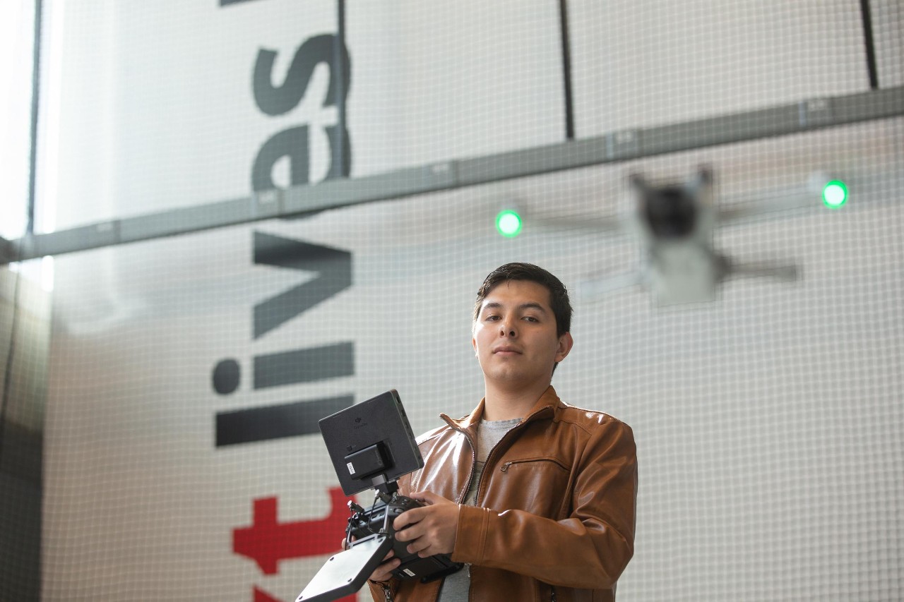 College of Engineering and Applied Science (CEAS) graduate students pose at the Digital Futures building.