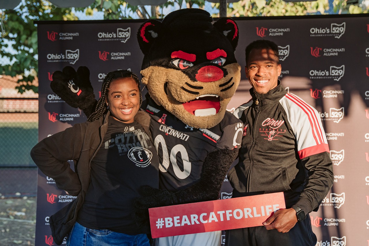 Bearcat and fans pose for a picture at the Homecoming Kickoff Party.