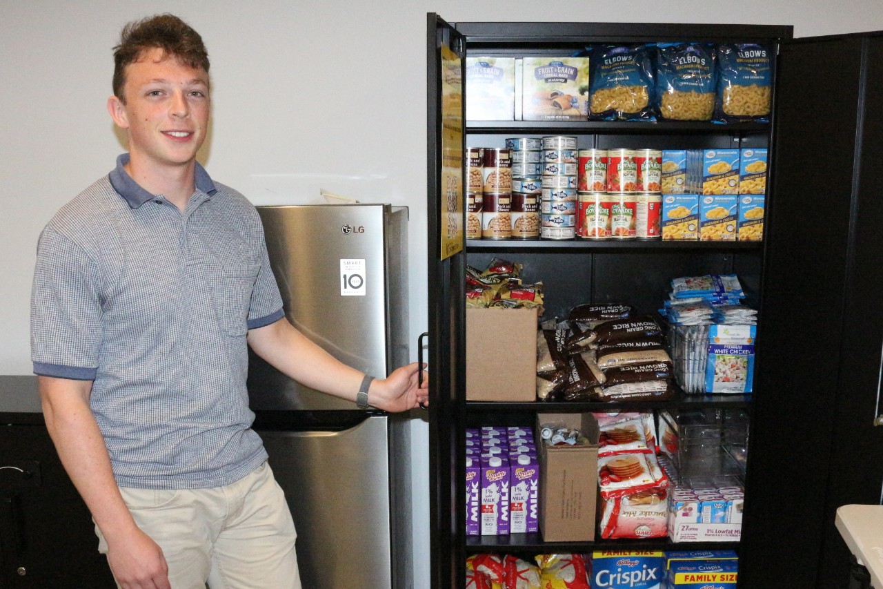 Student showing Bearcats Pantry location in HSB
