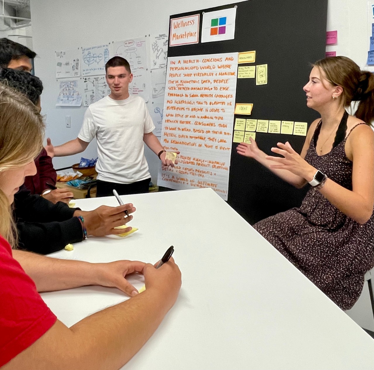 NIS student Max Kemats presents innovative ideas during a group activity.