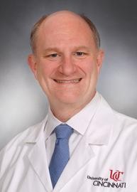 DAVID PLAS WITH UC LAB COAT     CANCER BIOLOGY