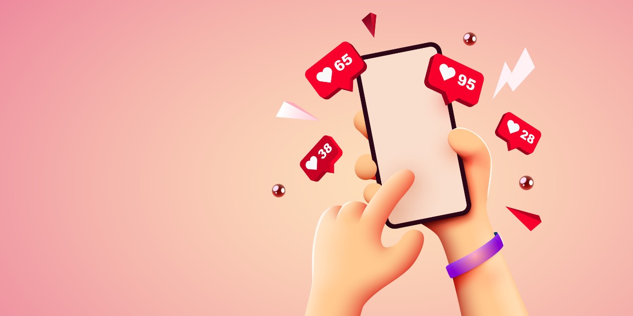 cell phone with icons of likes and clicks illuminated with hearts 