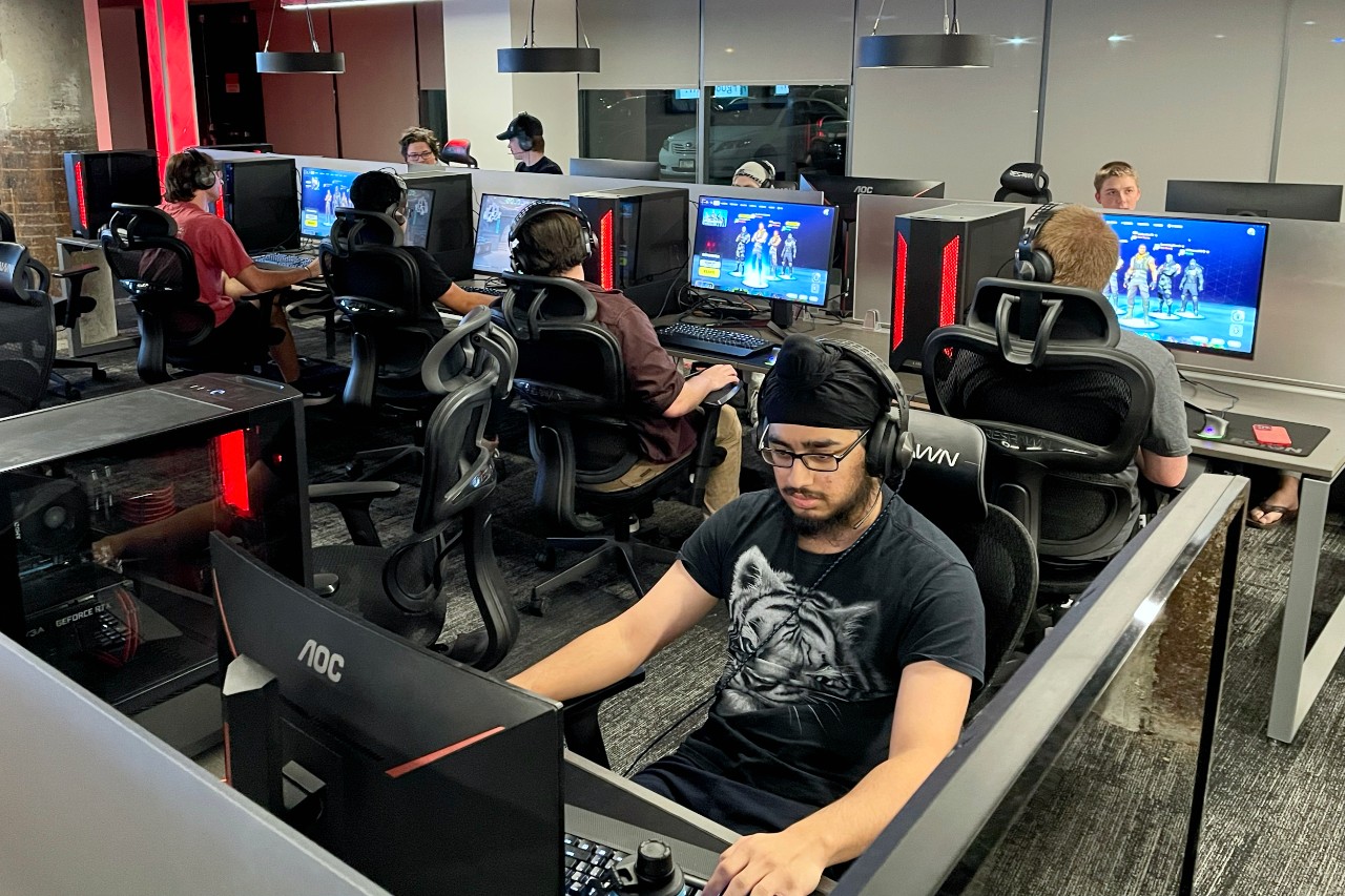 Students play video games inside UC's ESports Lab.