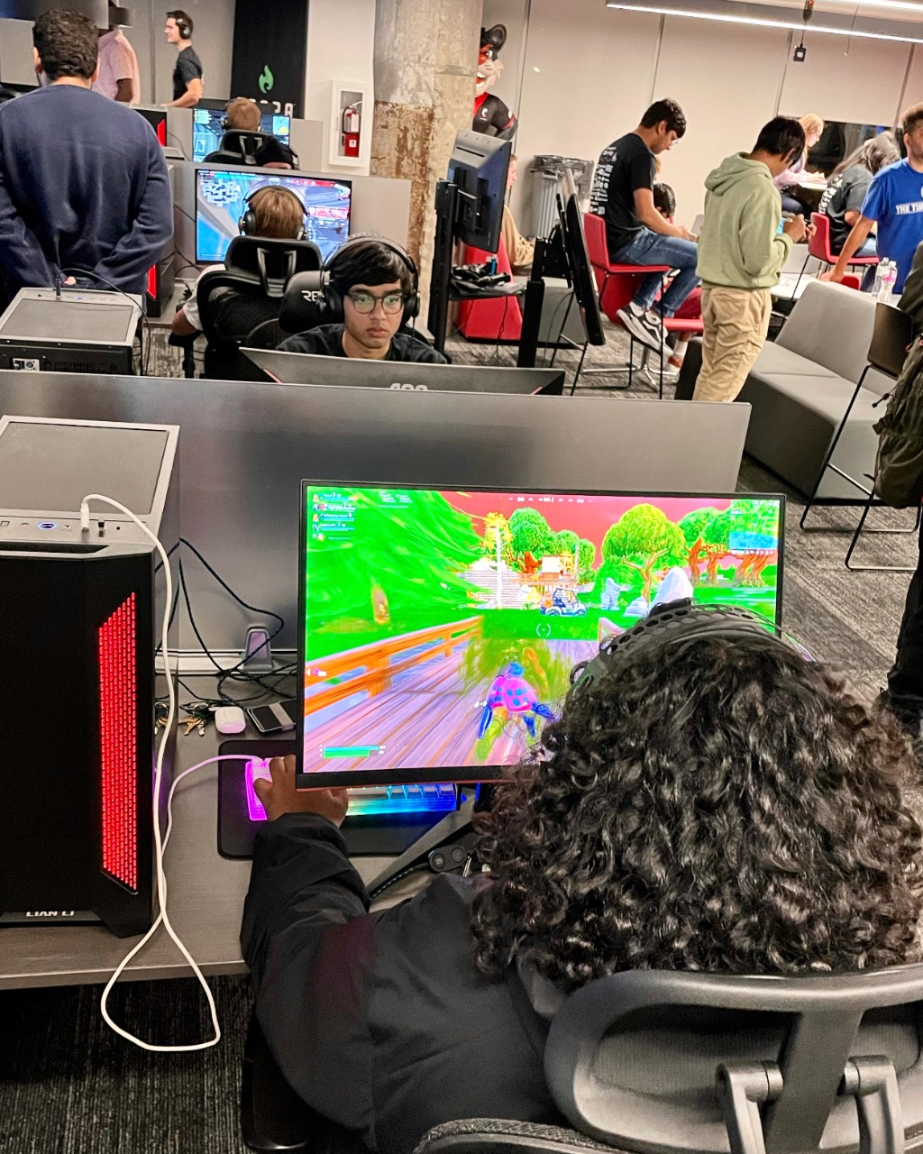 Students play video games in UC's ESports lab.