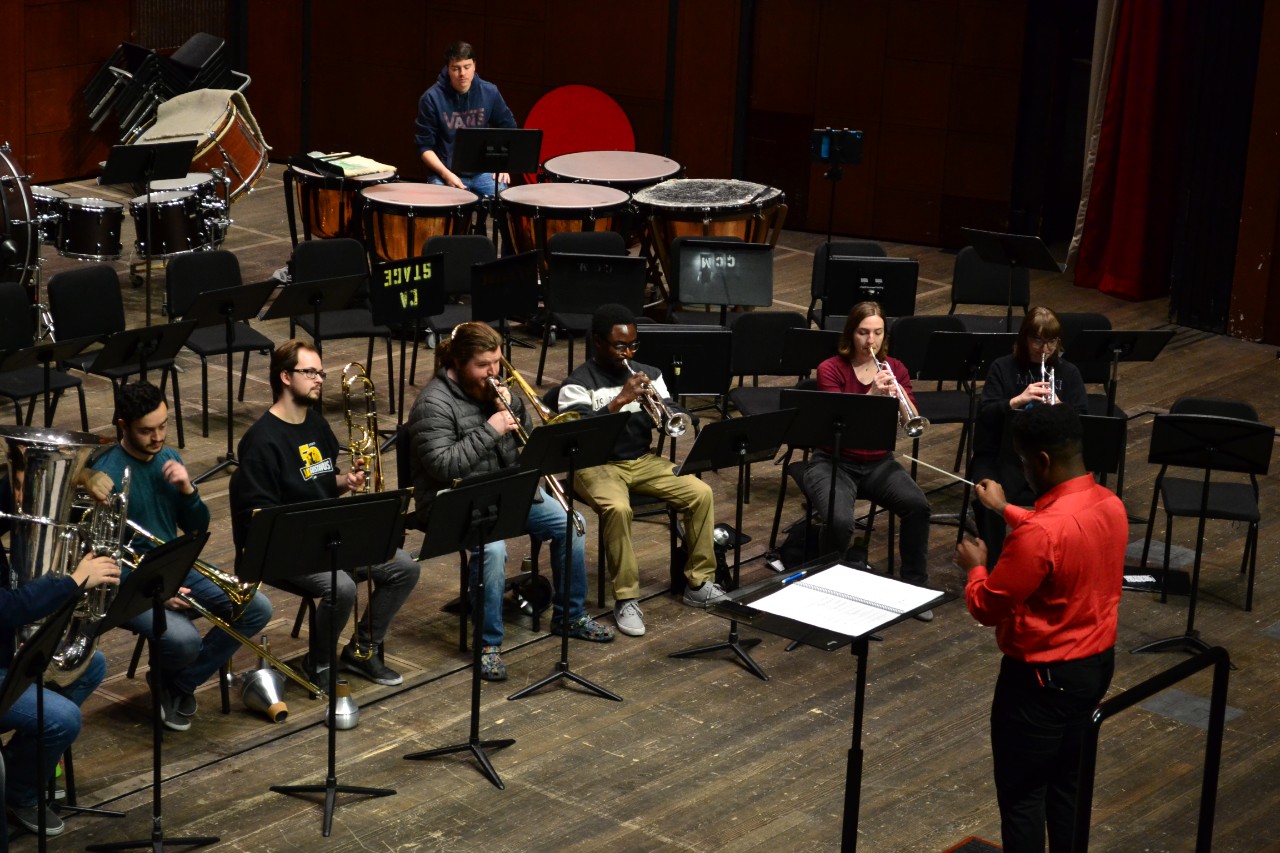 The CCM Wind Symphony rehearses in Corbett Auditorium. Photo by CCM graduate student conductor Pearce Nitta.