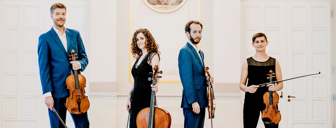 Ariel Quartet poses with their instruments. 