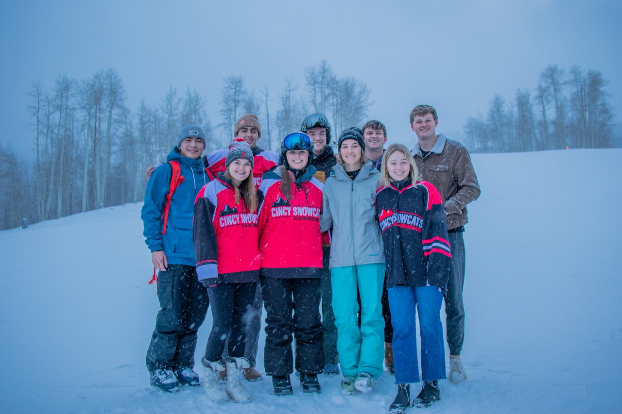 A group photo on a snowy mountain.