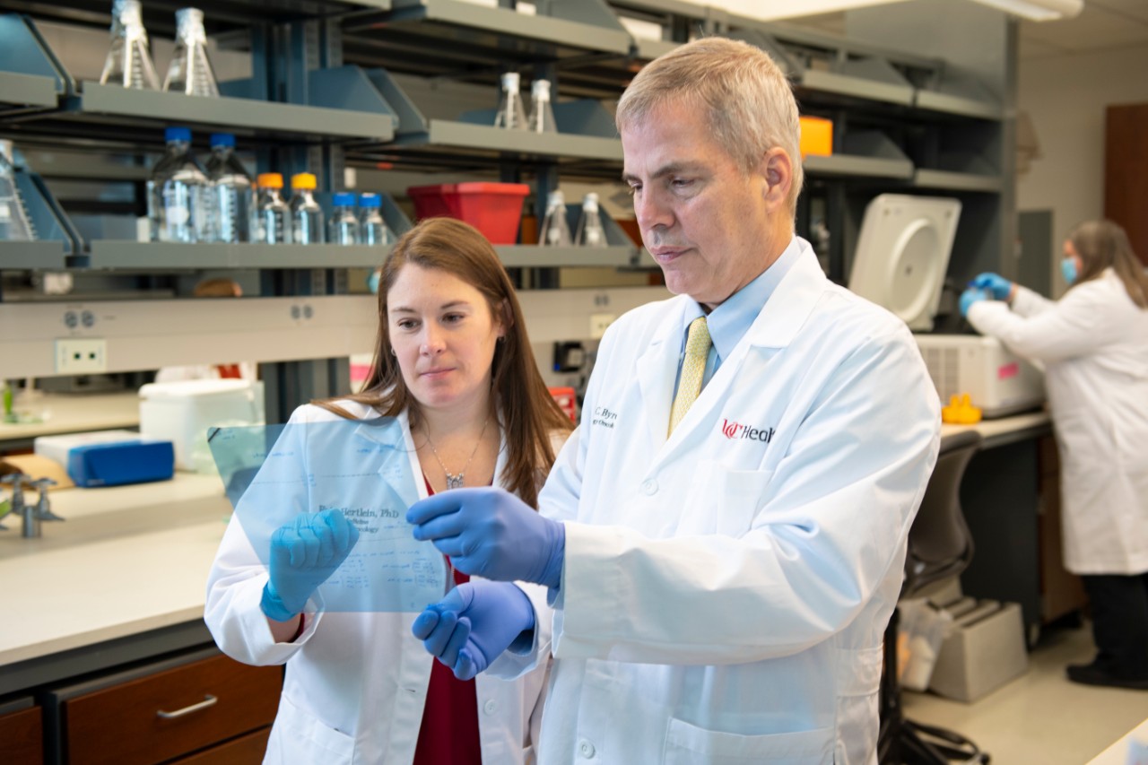 John C. Byrd, MD, in lab with his research team.