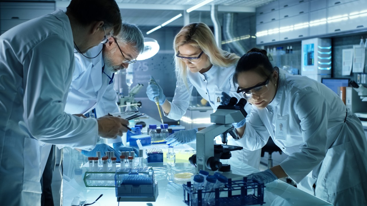 A team of medical research scientists collectively working. 