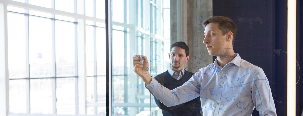 A team of entrepreneurs work together in a modern office. 