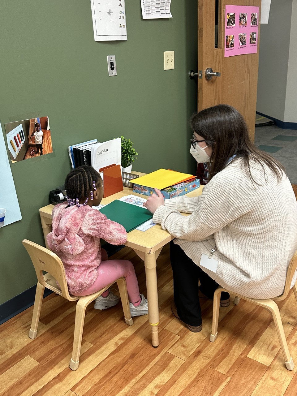 Teacher working with child