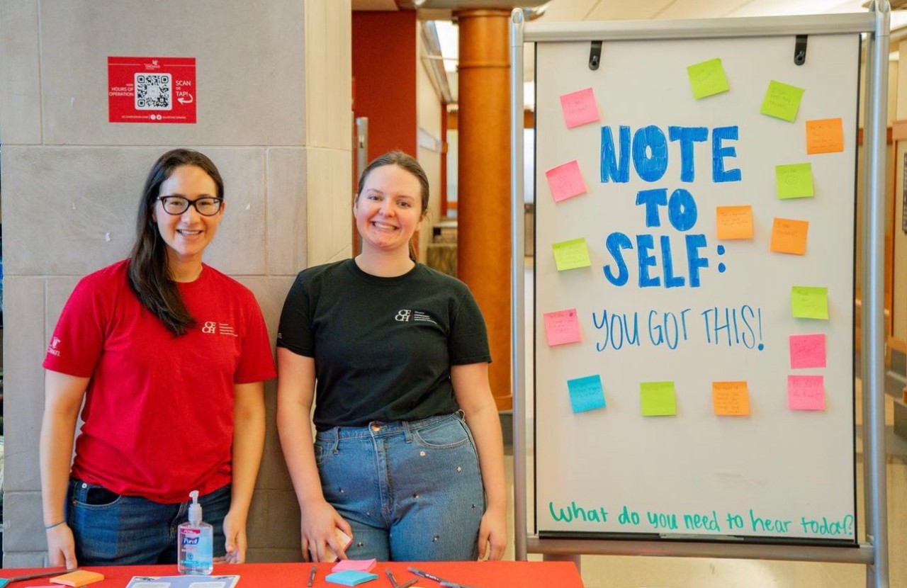 CECH's Student Services Center members Laura Carnaghi (left) and Halee Edwards (right) work a student success event in Teachers-Dyer Complex.  