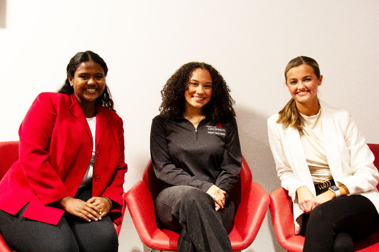three students sitting