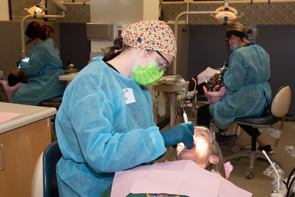 Dental Hygiene student treats a patient