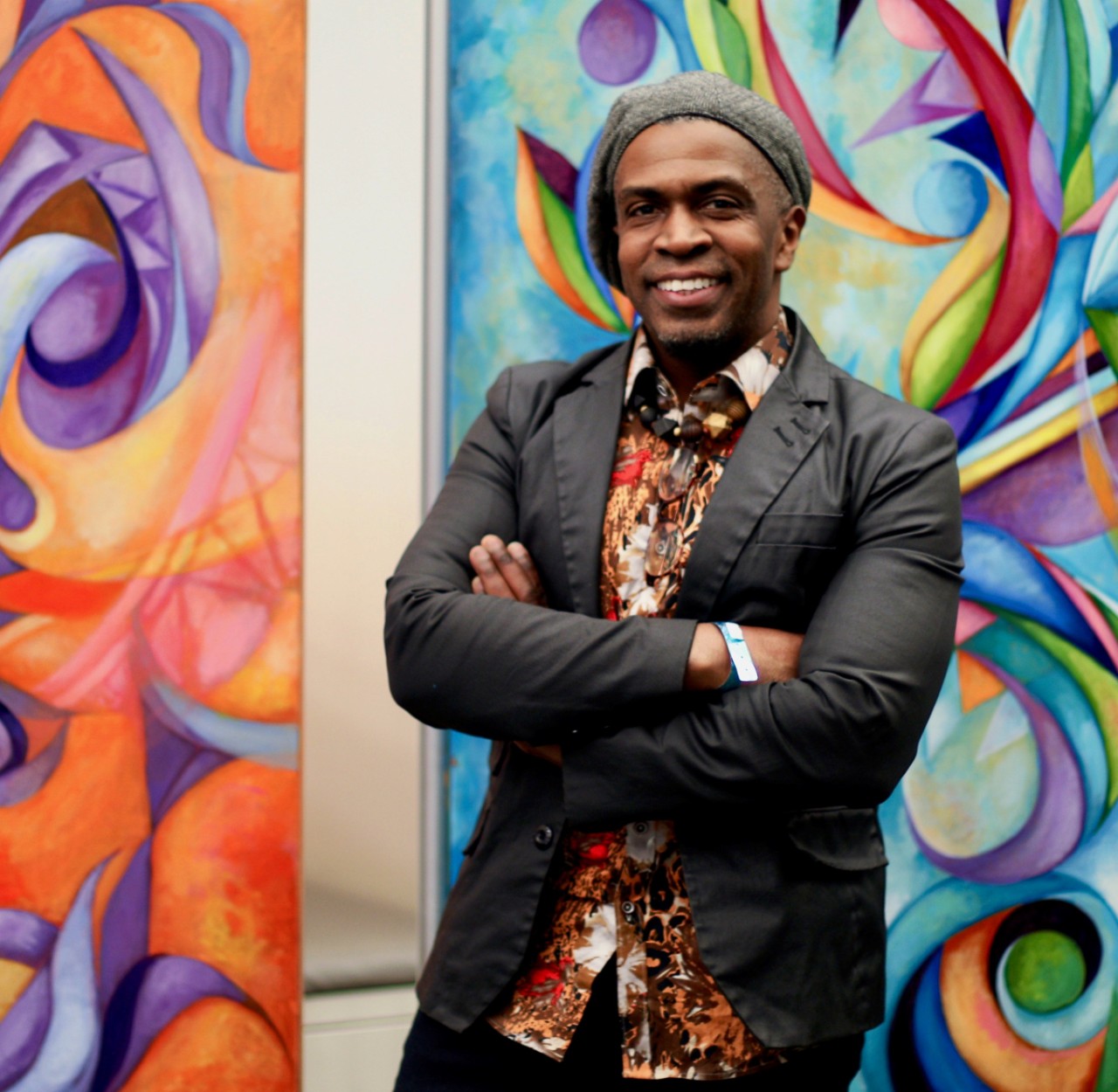 Man standing in front of  a painting