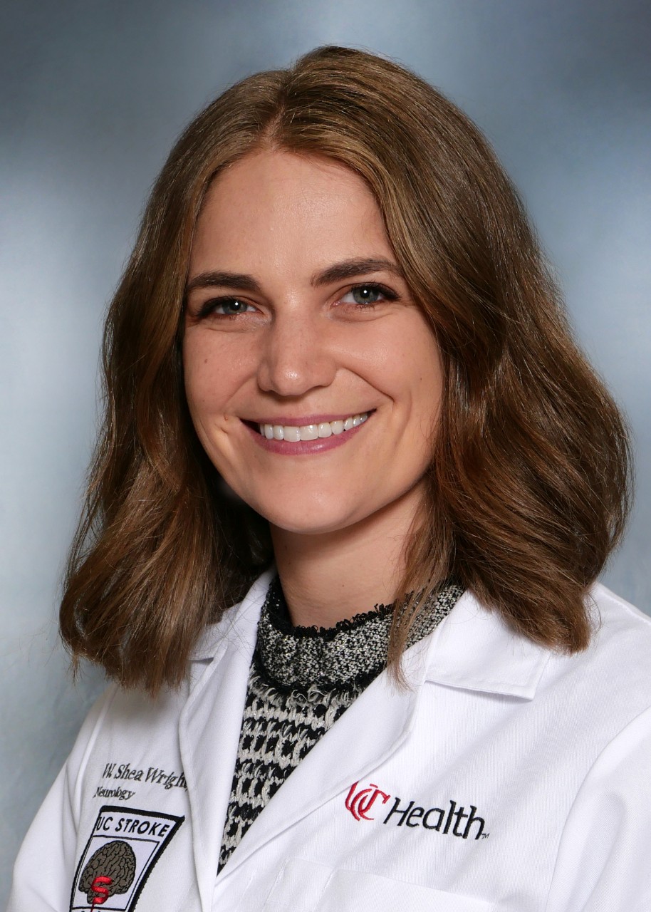 Shea Wright  2023 Neurology Fellow  with UCH lab coat