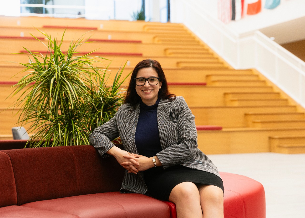 Second year law student Valerie Garcia sits in the atrium. 