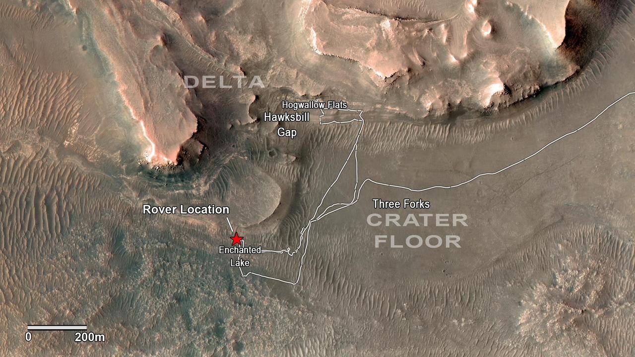 An aerial photo of a dry river delta identifies the crater floor, the delta and landmarks such as the rover location, Three Forks, Hogwallow Flats, Hawksbill Gap and Enchanted Lake.