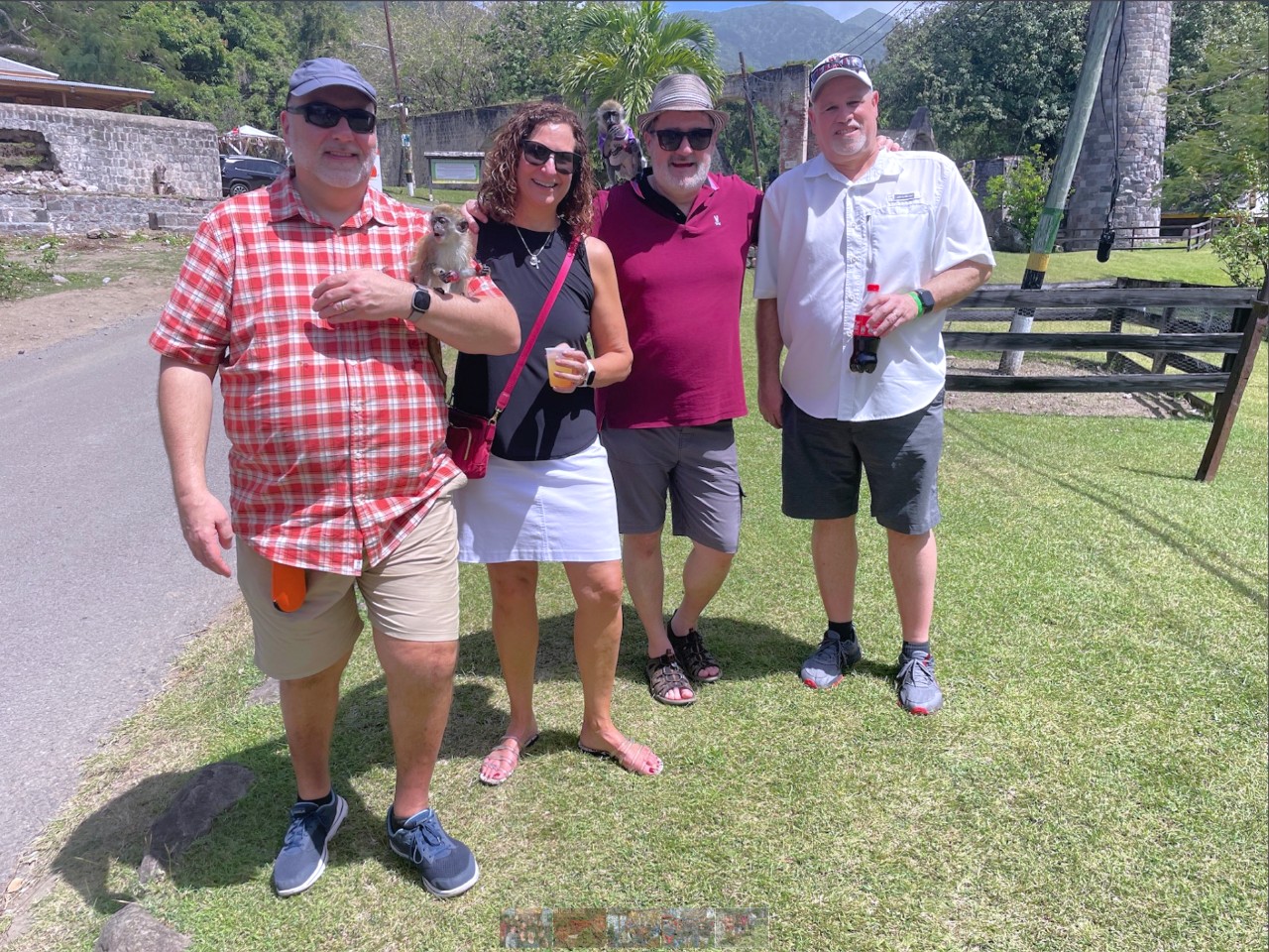 UC alum Randal Houts, second from right, stands with three friends in a tropical country.