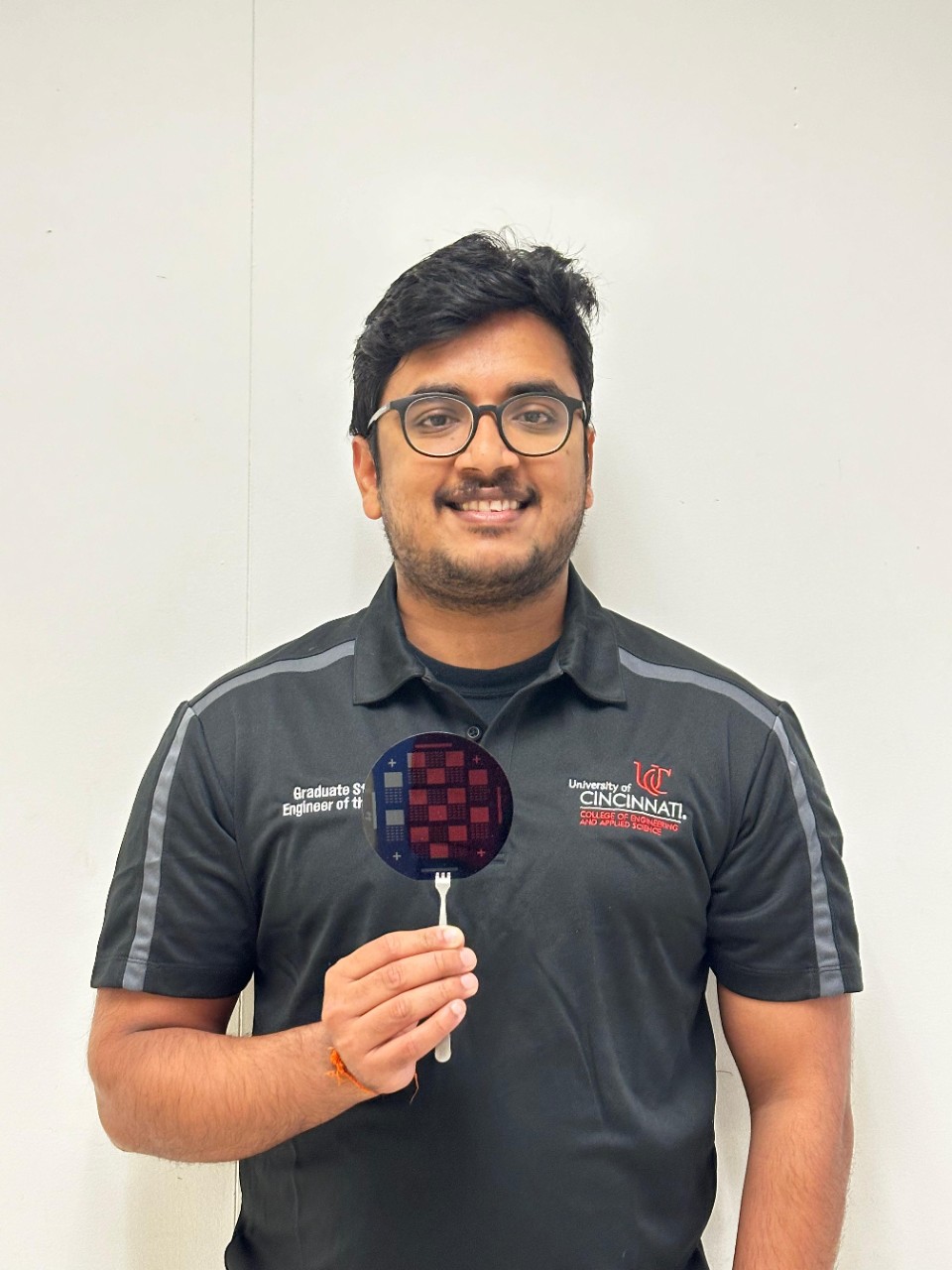 Vamshi Kiran Gogi holds one of his devices. 