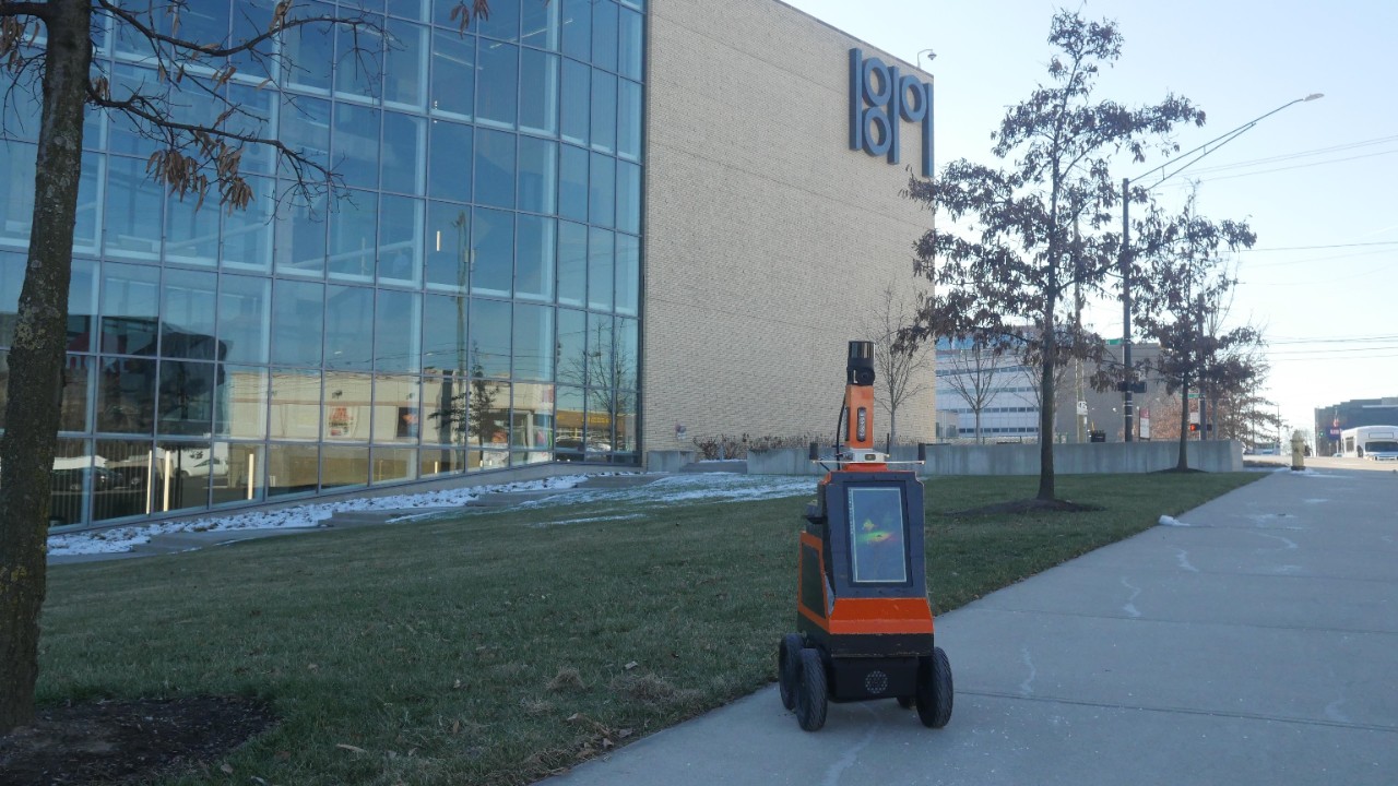 The Airtrek robot in front of the UC 1819 Innovation Hub