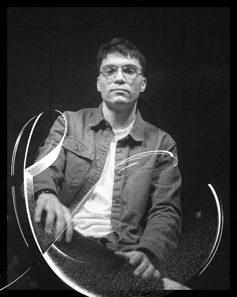 Spencer Roberts Headshot in black and white. The & typography he created overlays the lower left corner of his photo.