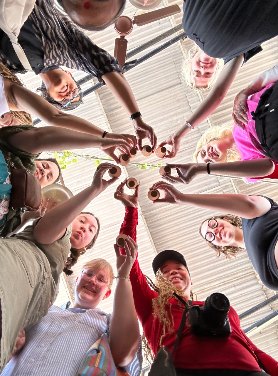 Students sharing moments of cultural exchange over cups of masala chai.