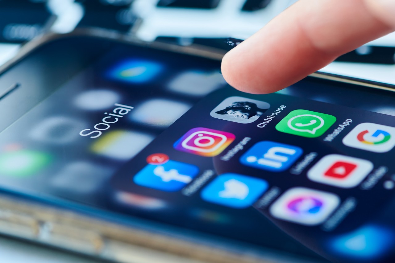 cell phone with icons of social media