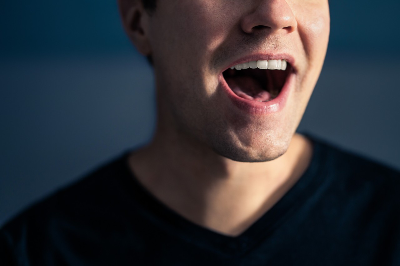 A closeup of a person talking.