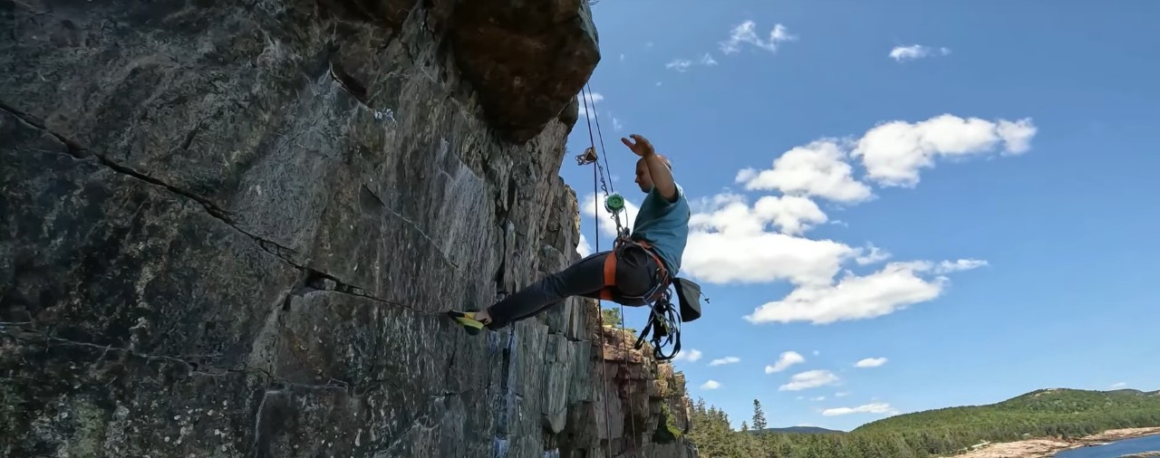 Rock climber using Bailout Systems technology