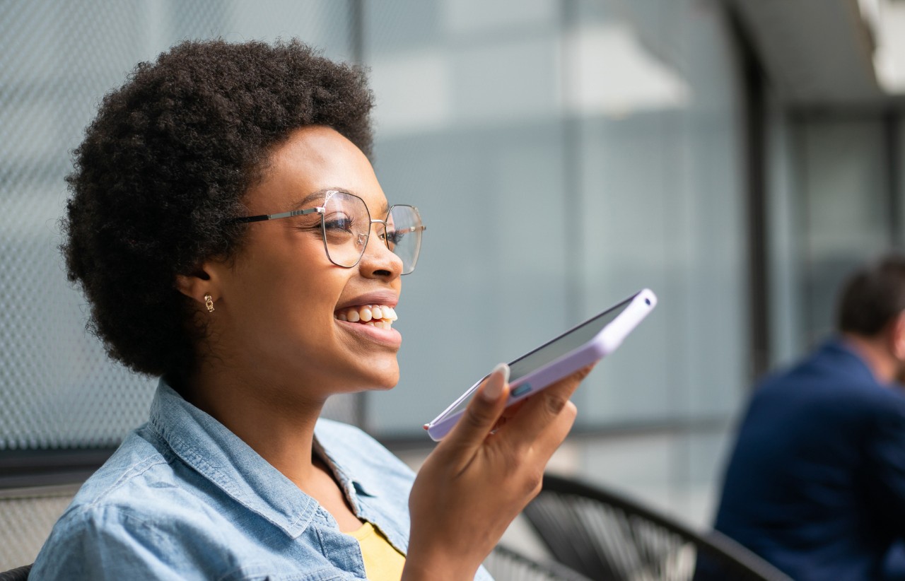 A closeup of a person talking on a phone.
