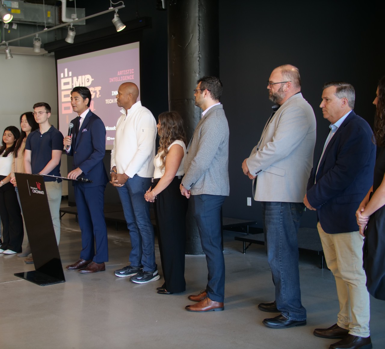 Panelists stand in unity to support responsible AI practices. Photo/Mary Dwyer