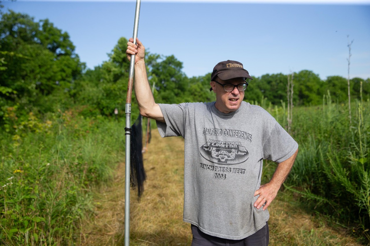 UC biologist and ornithologist Ron Canterbury at the Center for Field Studies with helpers banding birds for research.